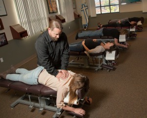 Dr. Rupp doing a chiropractic back adjustment in carlsbad
